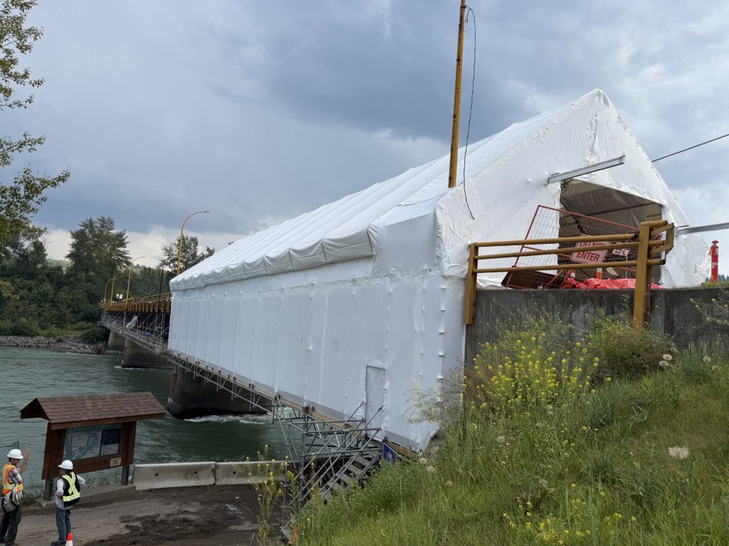 Industrial containment wrap applied to large-scale equipment